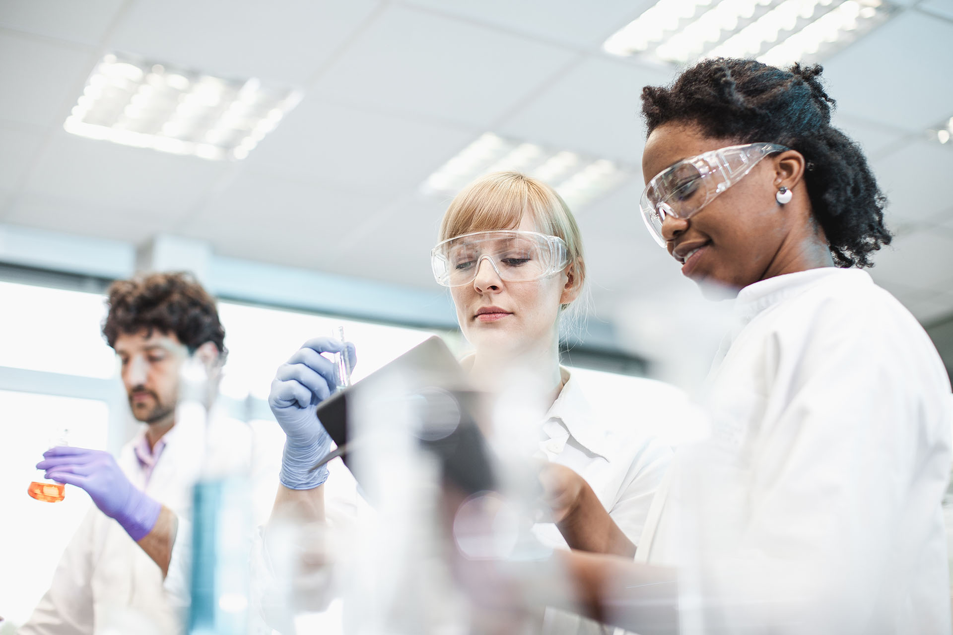 Three students in a science laboratory